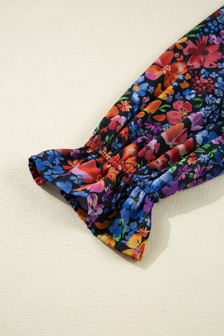 Vestido largo fluido con cuello en V, manga larga y estampado floral azul con borlas y lazo