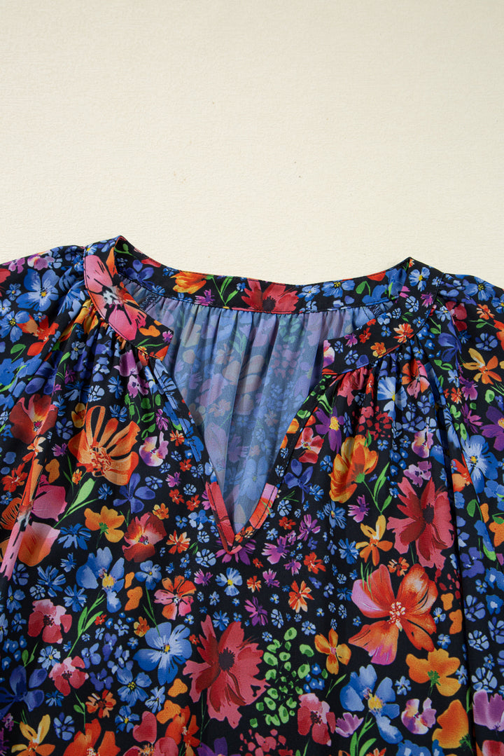 Vestido largo fluido con cuello en V, manga larga y estampado floral azul con borlas y lazo