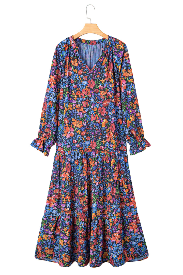 Vestido largo fluido con cuello en V, manga larga y estampado floral azul con borlas y lazo
